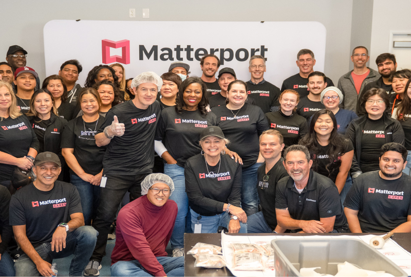 Group shot of smiling Matterport employees